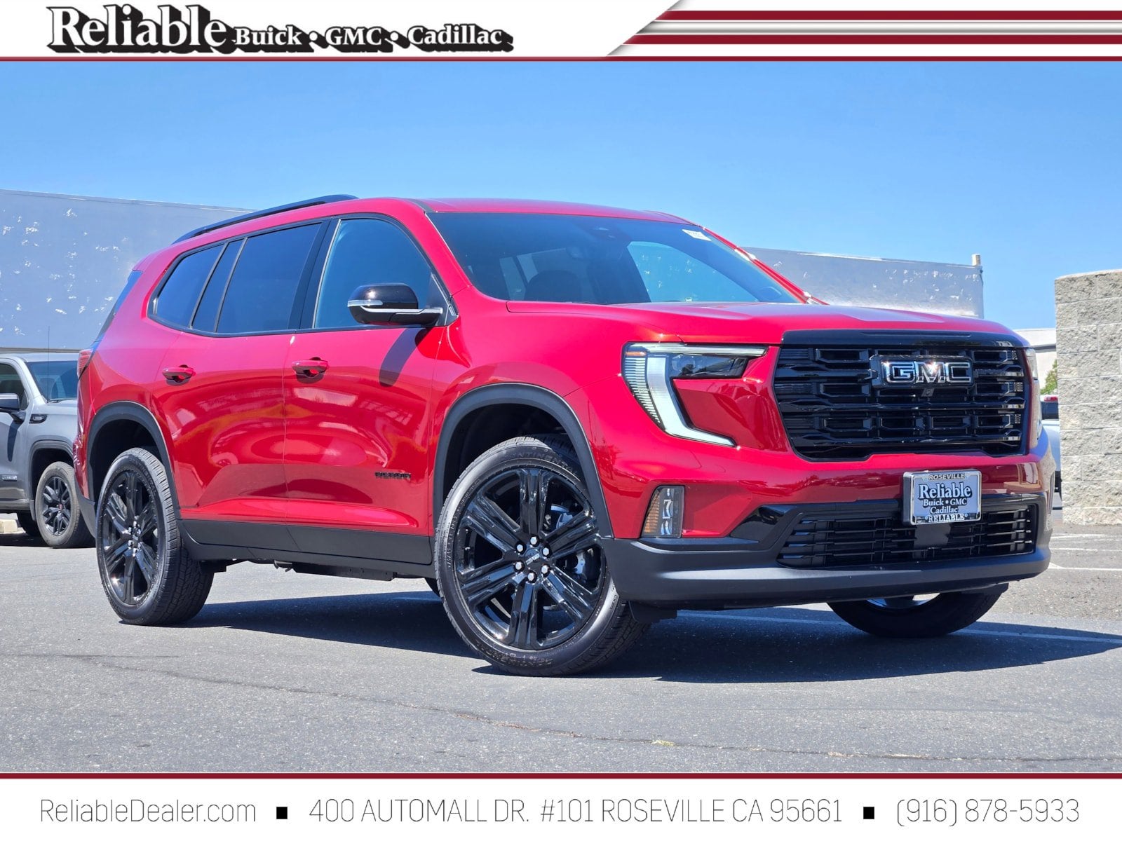 2026 GMC Acadia Elevation in Volcanic Red Tintcoat — front three-quarter view